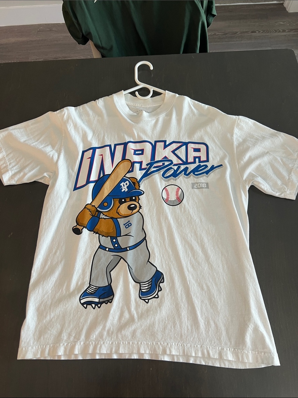 Inaka Power White Baseball Graphic Tee with Blue and Tan Accents